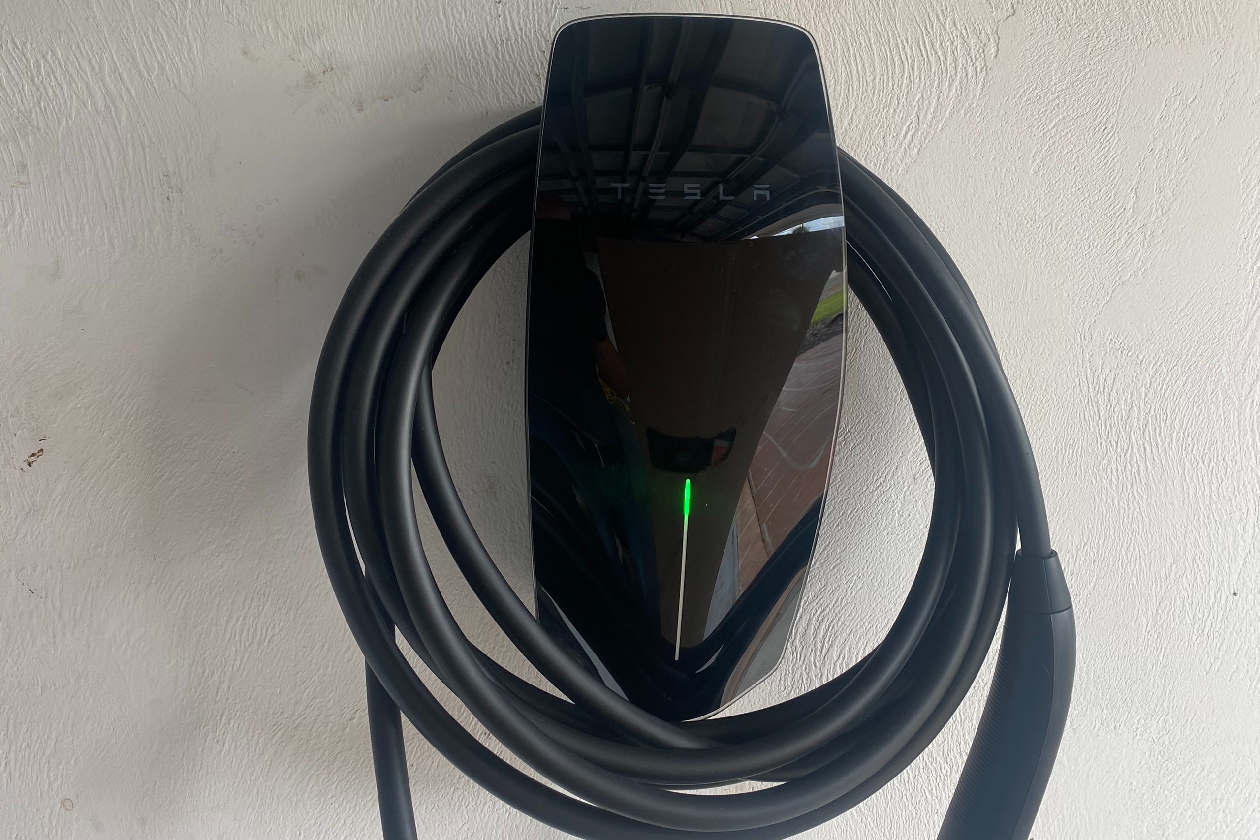 Black Tesla charger installation apartments garage top best certified official Tesla installer Palm Coast St. Augustine New Smyrna Beach Daytona Beach